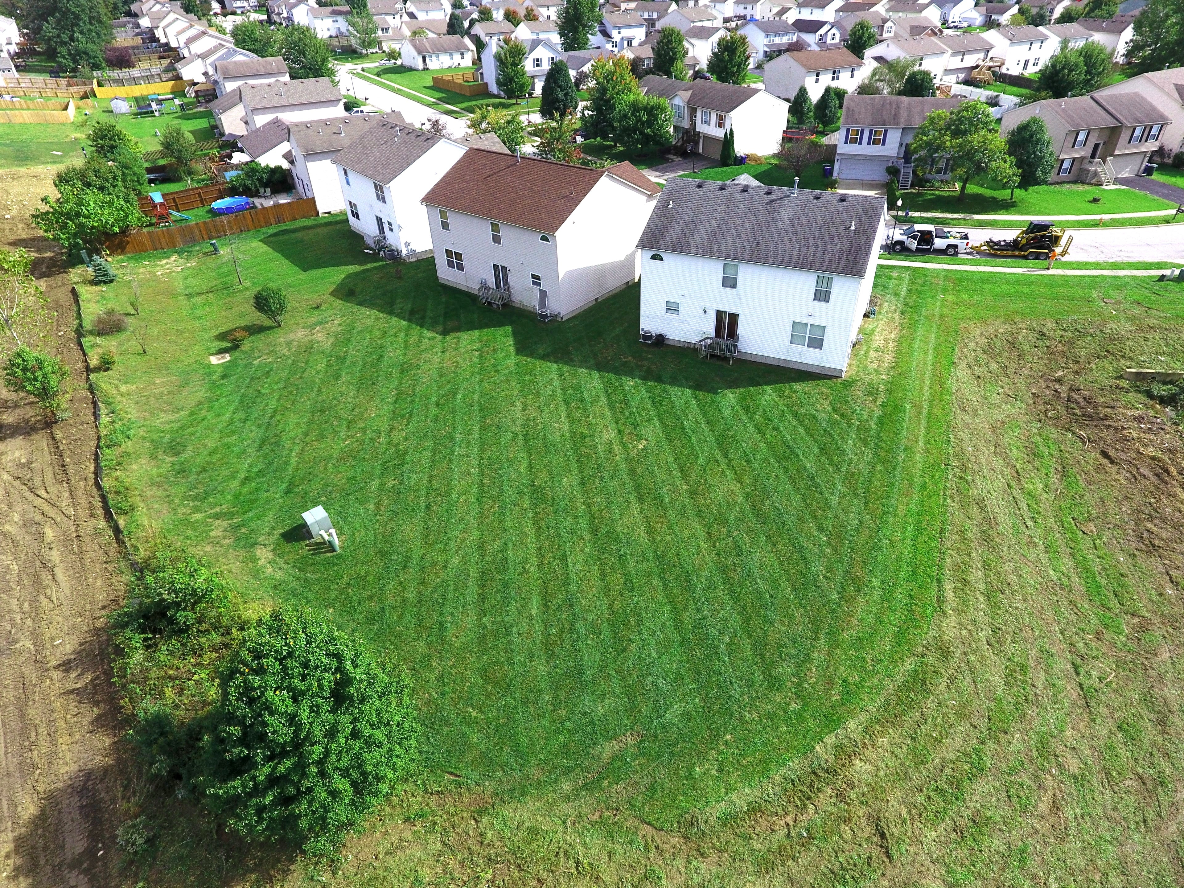 Professional lawn mowing on a residential property